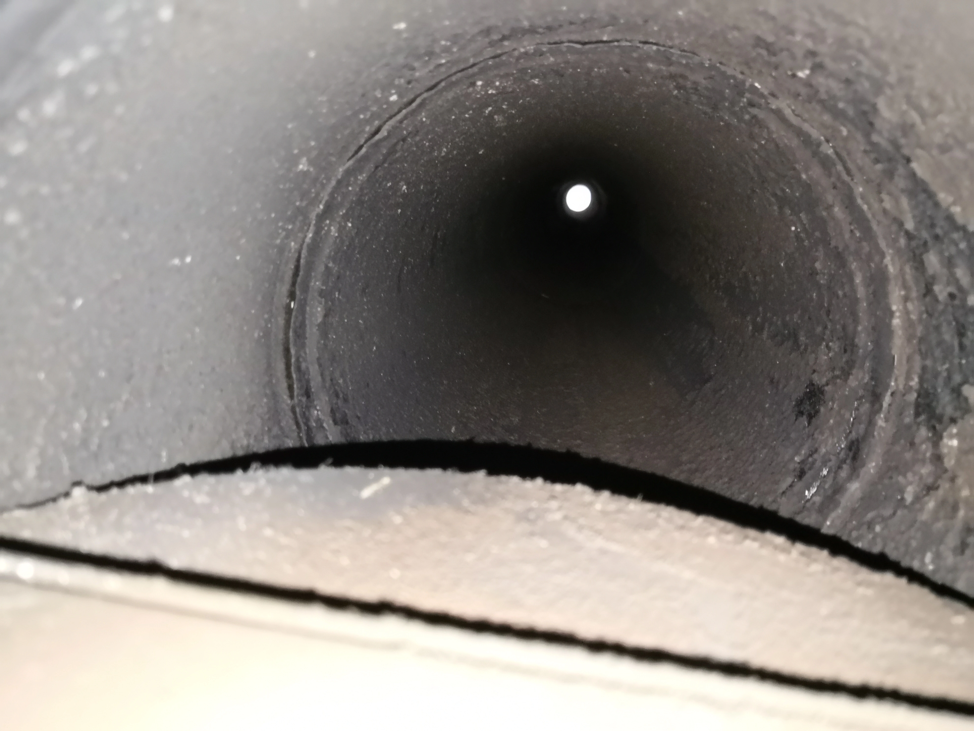 Chimney flue interior after professional sweeping in Raleigh NC — clean flue liner